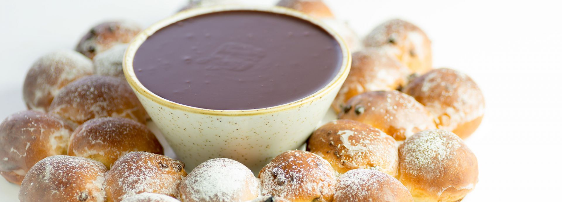 Tear and share dough balls with dark chocolate sauce