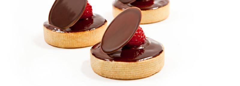 Plain tartlets with ganache glaze