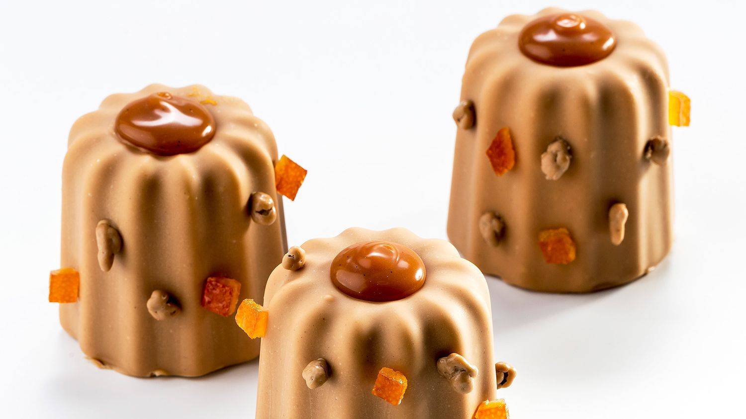 Canelés de avellana, naranja y malta