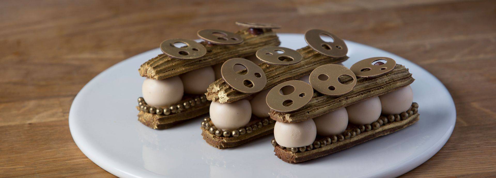 Gold chocolate éclair with salted caramel & tonka bean