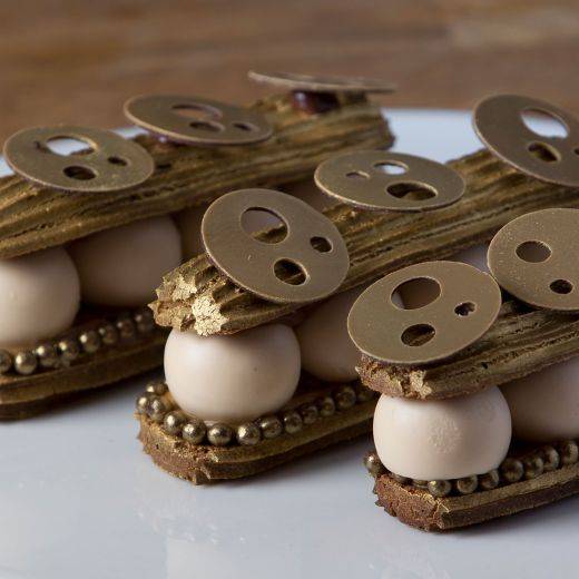 Gold chocolate éclair with salted caramel & tonka bean